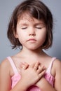 Little girl praying in lotus position Royalty Free Stock Photo