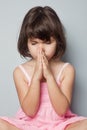 Little girl praying in lotus position Royalty Free Stock Photo