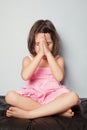 Little girl praying in lotus position Royalty Free Stock Photo