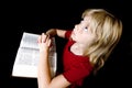 Little Girl Praying Over Bible Royalty Free Stock Photo
