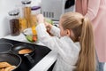 little girl preparing fresh vegetable salad Royalty Free Stock Photo