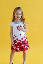 Little girl presses a red paper heart to her chest. Health and Valentine`s day concept Royalty Free Stock Photo