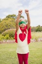 Little girl pretending pretending to fly with superhero costume Royalty Free Stock Photo