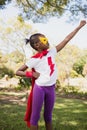 A little girl pretending to fly with superhero costume Royalty Free Stock Photo