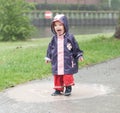 Little girl in a puddle