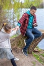 The little girl wants to go out with her dad, but he is busy with the phone Royalty Free Stock Photo