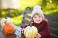 Little girl with pumpkin harvest, Thanksgiving.