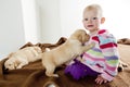 Little girl with puppies Royalty Free Stock Photo