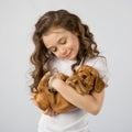 Little girl with puppy isolated on white background. Kid Pet Friendship Royalty Free Stock Photo