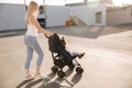 Mother walks with baby carrige