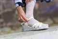 Little girl putting on her sandals Royalty Free Stock Photo