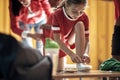 A little girl putting on sneakers for a training. Children team sport Royalty Free Stock Photo