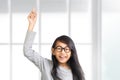 Little Girl Raise Her Hand and Pointing Finger Up Royalty Free Stock Photo