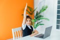 Little girl raising her hand up for answer at lesson at school Royalty Free Stock Photo