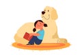 Little girl read to her dog. Happy kid and pet spend time together Royalty Free Stock Photo