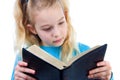 Little girl is reading the Bible Royalty Free Stock Photo
