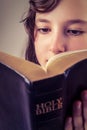 Little girl reading the bible Royalty Free Stock Photo