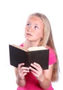 Little girl reading bible on white