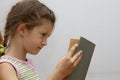 Little girl reading big book Royalty Free Stock Photo