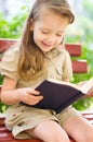 Little girl is reading a book Royalty Free Stock Photo