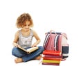 A little girl reading a book on the floor Royalty Free Stock Photo