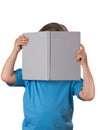 Little girl reading a book and hide her face. Isolated