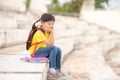 Little girl reading book thinking face Royalty Free Stock Photo