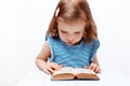 Little girl reading book. on white background Royalty Free Stock Photo