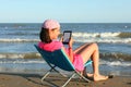 Little girl while reading an electronic text from an e-book