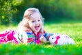 Little girl and real rabbit Royalty Free Stock Photo