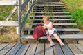 Little girl and red bag.