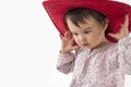 Little girl with red cowboy hat isolated on white Royalty Free Stock Photo