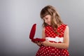Little girl in red dress holding her present Royalty Free Stock Photo