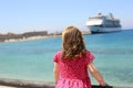 little girl red dress looks cruise liner Royalty Free Stock Photo