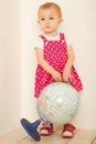 Little girl in red dress stadning at full height Royalty Free Stock Photo