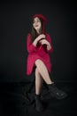 Little Girl Red Dressed Sitting on a Stool