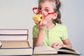 Little girl in red glasses bitten apple Royalty Free Stock Photo