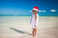 Little girl in red hat santa claus and sunglasses Royalty Free Stock Photo