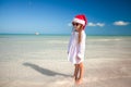 Little girl in red hat santa claus and sunglasses Royalty Free Stock Photo