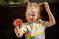 Little girl with red lollipop. close-up Royalty Free Stock Photo