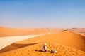 Little girl on red sand dune Royalty Free Stock Photo