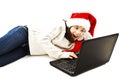 Little girl in red Santa hat look shocked when looking at laptop computer Royalty Free Stock Photo