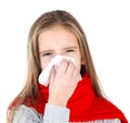 Little girl in red scarf blowing her nose Royalty Free Stock Photo