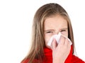 Little girl in red scarf blowing her nose Royalty Free Stock Photo