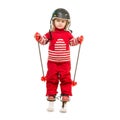 Little girl in red ski suit standing on skis