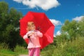 Little girl with red umbrella outdoor Royalty Free Stock Photo