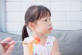 Little girl refuse to eat tomato in spagethi from her mother Royalty Free Stock Photo