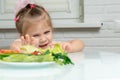 Little girl refuses vegetables Royalty Free Stock Photo