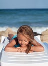 Little girl relaxing on a beach chair Royalty Free Stock Photo