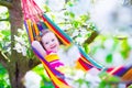 Little girl relaxing in a hammock Royalty Free Stock Photo